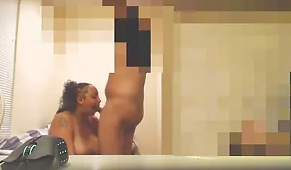 Busty black babe munches on his hard cock on a hidden cam