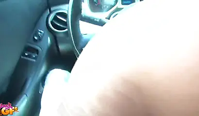 Tiny Ebony gives a blowjob to her man while in the car