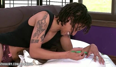 Naughty amateur black chick penetrates her hairy cunt with a toy