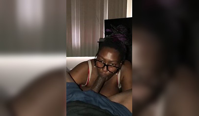 Jizz hungry amateur black babe with glasses sucks a BBC