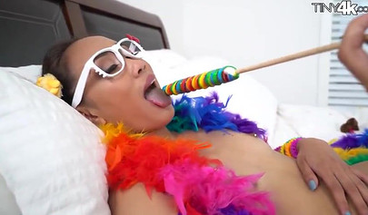 Naughty schoolgirl Aria Skye plays around with a lollipop before her man arrives