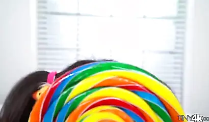 Naughty schoolgirl Aria Skye plays around with a lollipop before her man arrives