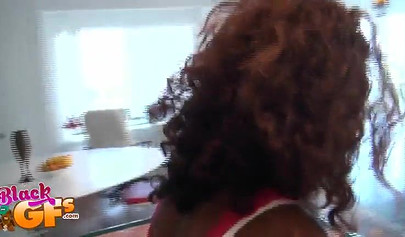 Desirable ebony chick teases with her pretty body in the kitchen
