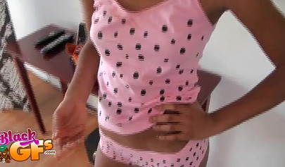 Desirable ebony chick teases with her pretty body in the kitchen