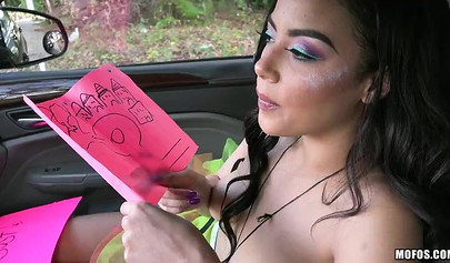 Maya Bijou shows off her titties in the car for the camera