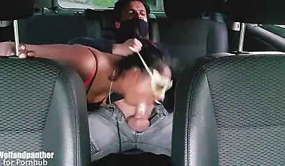 Beauty gives a blowjob to her man in the back seat