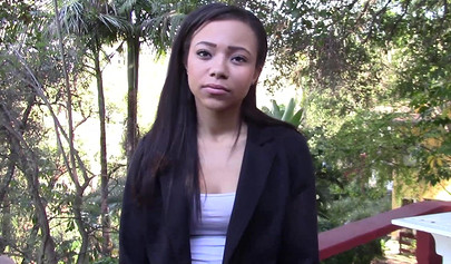 Black girl gets on her knees and then sucks on a big white dick while moaning