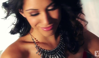 Hot brown babe poses for Playboy while the photographer enjoys taking her pictures