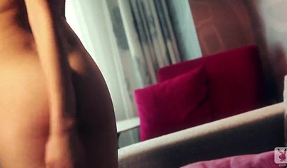 Hot brown babe poses for Playboy while the photographer enjoys taking her pictures