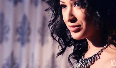 Hot brown babe poses for Playboy while the photographer enjoys taking her pictures