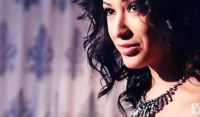 Hot brown babe poses for Playboy while the photographer enjoys taking her pictures