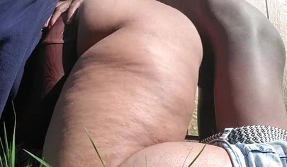 Black girl gets naughty in neighbors backyard and takes a long dick inside her