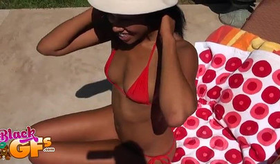 Bikini ebony chick loves catching some rays by the pool side and masturbating too