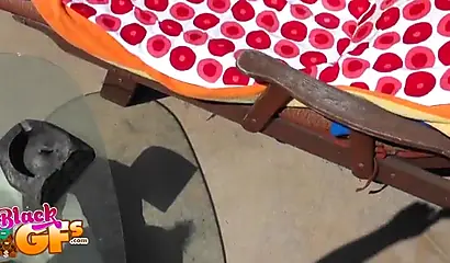 Bikini ebony chick loves catching some rays by the pool side and masturbating too