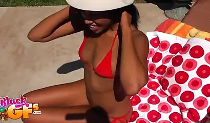 Bikini ebony chick loves catching some rays by the pool side and masturbating too