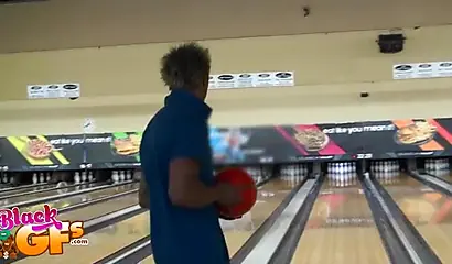 Ebony babe goes bowling and is seduced by a white dude to show and flash her tits
