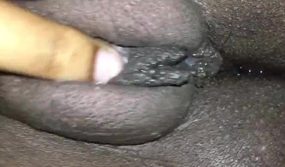 Close up video of a black cock entering a black pussy hard with her legs spread