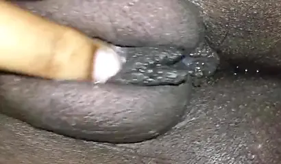 Close up video of a black cock entering a black pussy hard with her legs spread