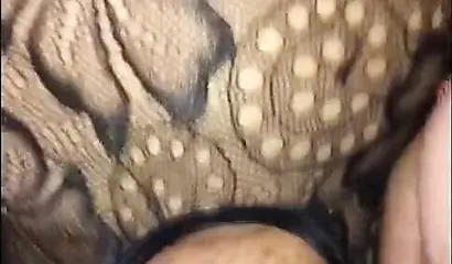 Slutty black whore in fishnet stockings loves sucking cock and getting a facial