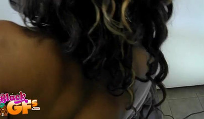 Cute black babe with natural tits and a tattoo on her back gets fucked in bed hard