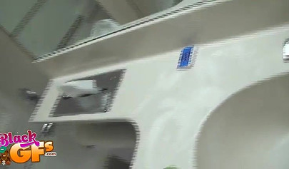 Sexy black amateur babe records herself teasing with her body in front of a mirror