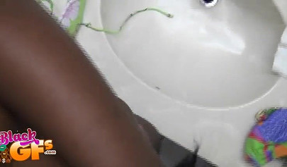 Sexy black amateur babe records herself teasing with her body in front of a mirror