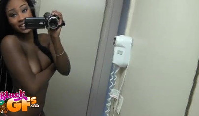 Sexy black amateur babe records herself teasing with her body in front of a mirror