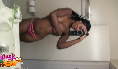 Sexy black amateur babe records herself teasing with her body in front of a mirror