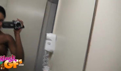 Sexy black amateur babe records herself teasing with her body in front of a mirror