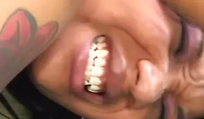 Black babe with tattoos on her ass cheeks gets fucked