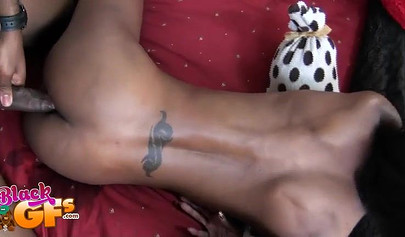 Gorgeous skinny ebony babe with lower back tattoo gets fucked
