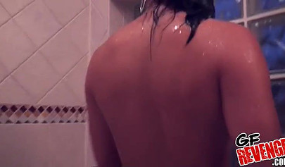 Ebony babe showers and gets filmed while doing it too