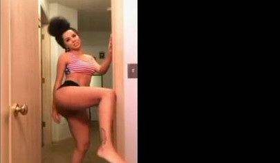 A big booty black girl shakes those phat cheeks and titties for her audience