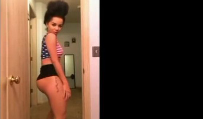 A big booty black girl shakes those phat cheeks and titties for her audience
