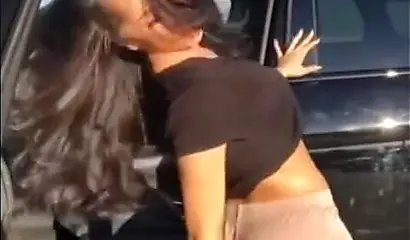 A big booty black girl shakes those phat cheeks and titties for her audience
