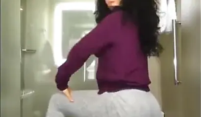 A big booty black girl shakes those phat cheeks and titties for her audience