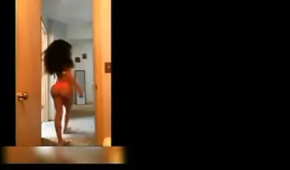 A big booty black girl shakes those phat cheeks and titties for her audience