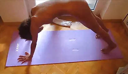 Naked skinny black chick takes it upon herself to train some yoga in her home