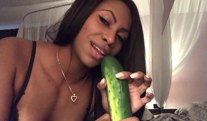 Stunning black chick greases up a pickle and puts it inside her tight wet puss