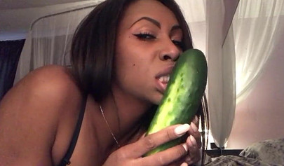 Stunning black chick greases up a pickle and puts it inside her tight wet puss