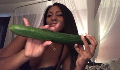 Stunning black chick greases up a pickle and puts it inside her tight wet puss