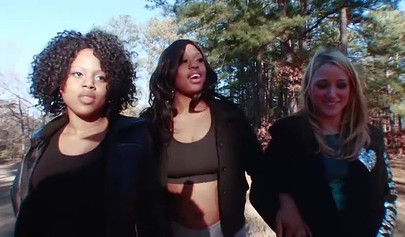 Two ebony girls participate in a lesbian orgy with a cute and hot white girl