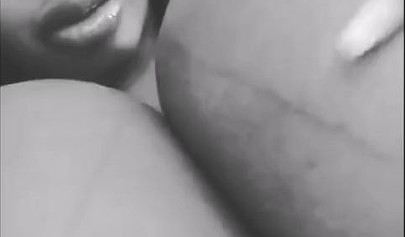 Black chick with implants shows her massive titties and loves the feeling of it