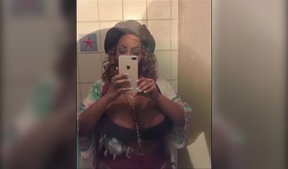 Black chick with implants shows her massive titties and loves the feeling of it