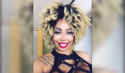 Black chick with implants shows her massive titties and loves the feeling of it