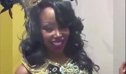 Black chick with implants shows her massive titties and loves the feeling of it