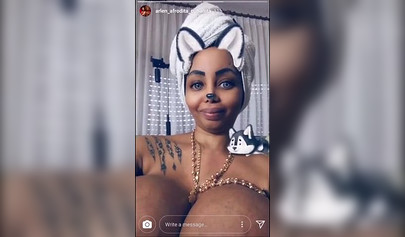 Black chick with implants shows her massive titties and loves the feeling of it