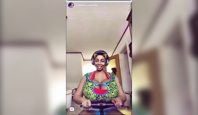 Black chick with implants shows her massive titties and loves the feeling of it