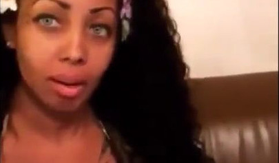 Black chick with implants shows her massive titties and loves the feeling of it