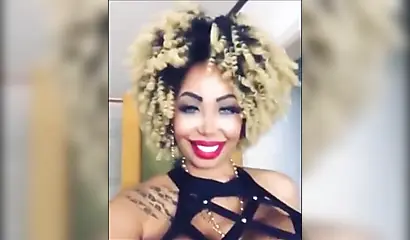 Black chick with implants shows her massive titties and loves the feeling of it